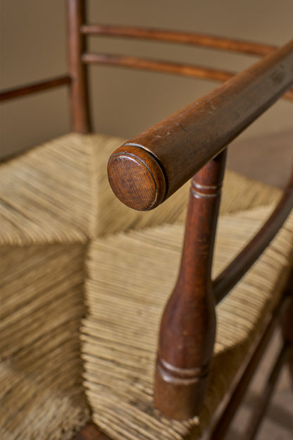 Arts & Crafts English oak and rush seat armchair