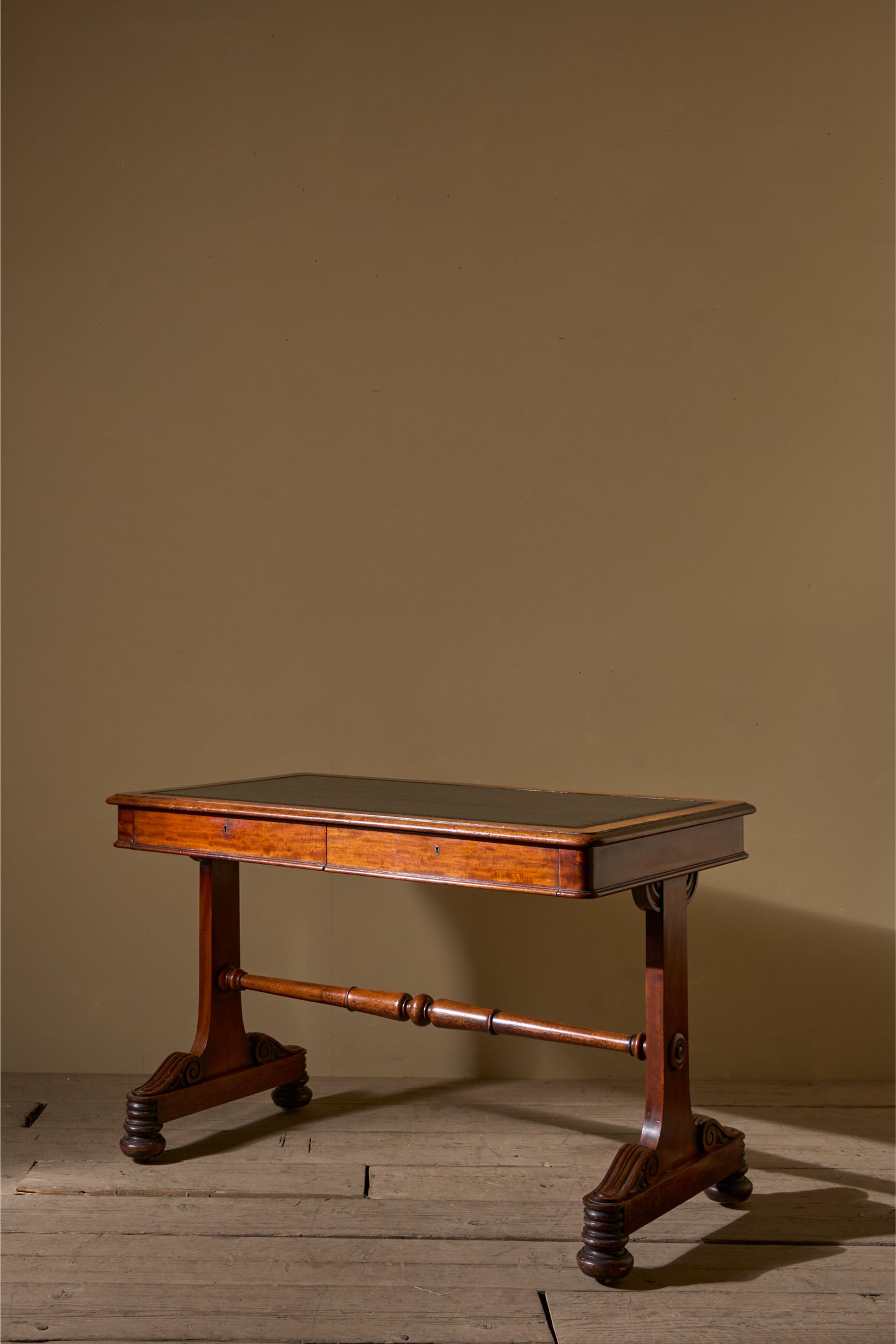 Early Victorian mahogany and black leather writing table by Johnstone & Jeanes