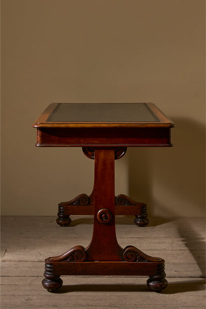 Early Victorian mahogany and black leather writing table by Johnstone & Jeanes
