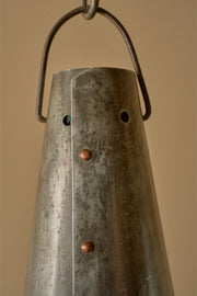 Trio of 20th century patinated steel and copper rivet conical pendant lights