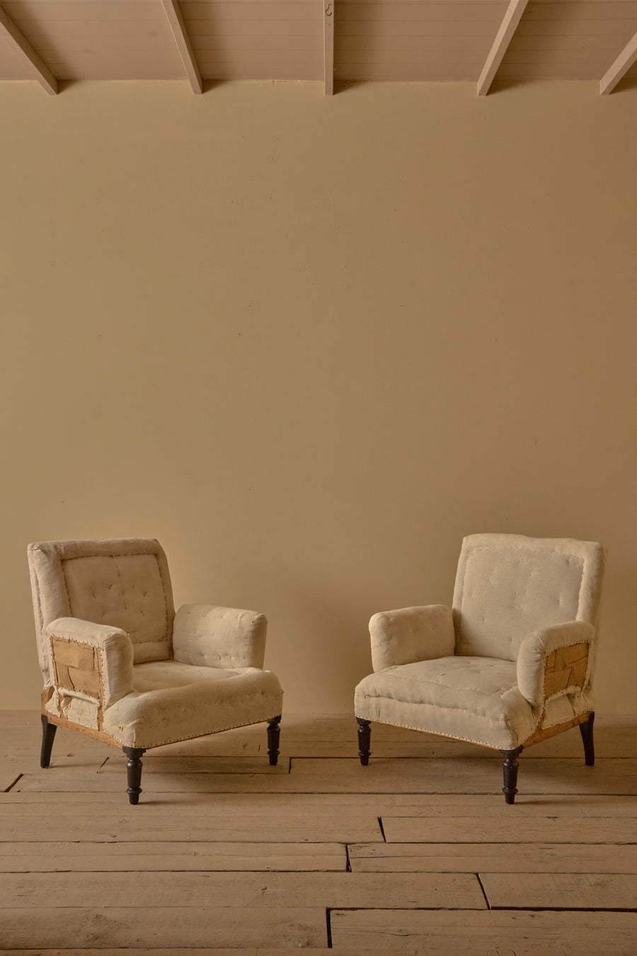 Pair of Napoleon III high backed pillow armed armchairs
