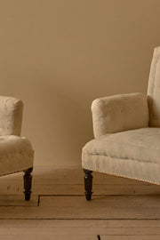 Pair of Napoleon III high backed pillow armed armchairs