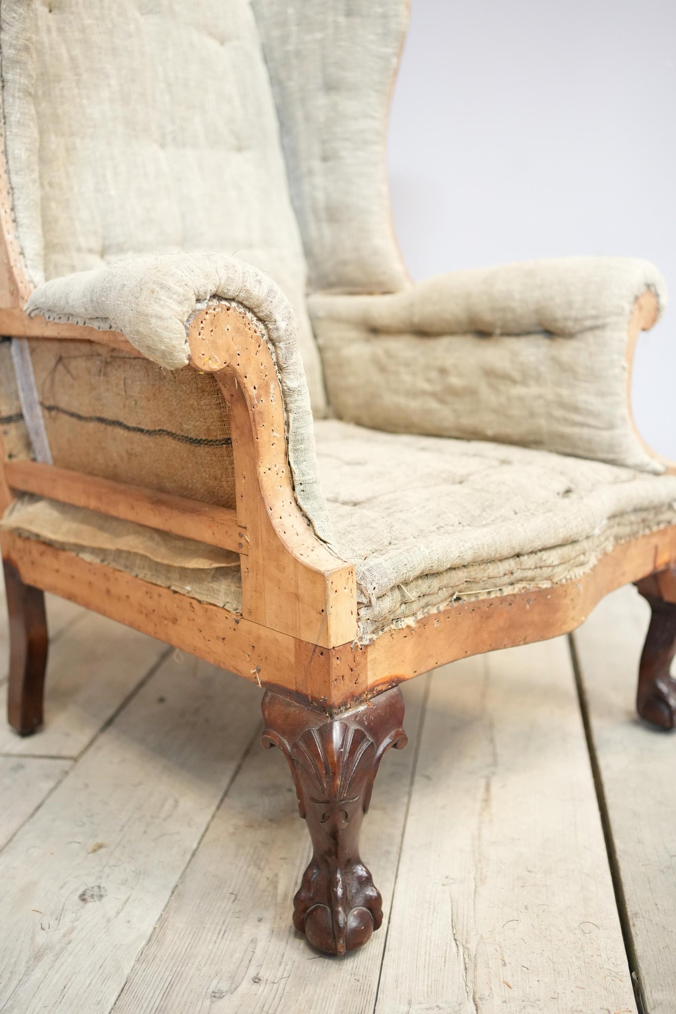 Georgian style wingback armchair with shaped seat