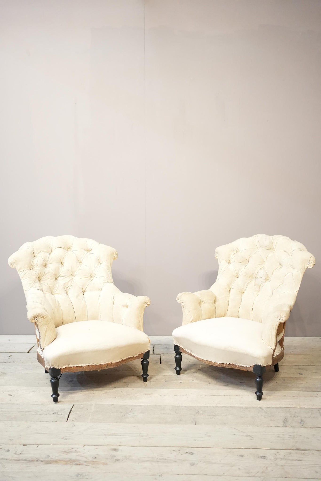 Pair of Napoleon III buttoned fishtail armchairs