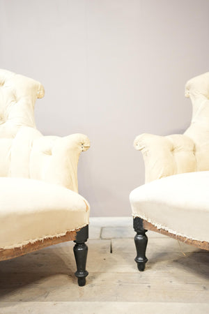 Pair of Napoleon III buttoned fishtail armchairs