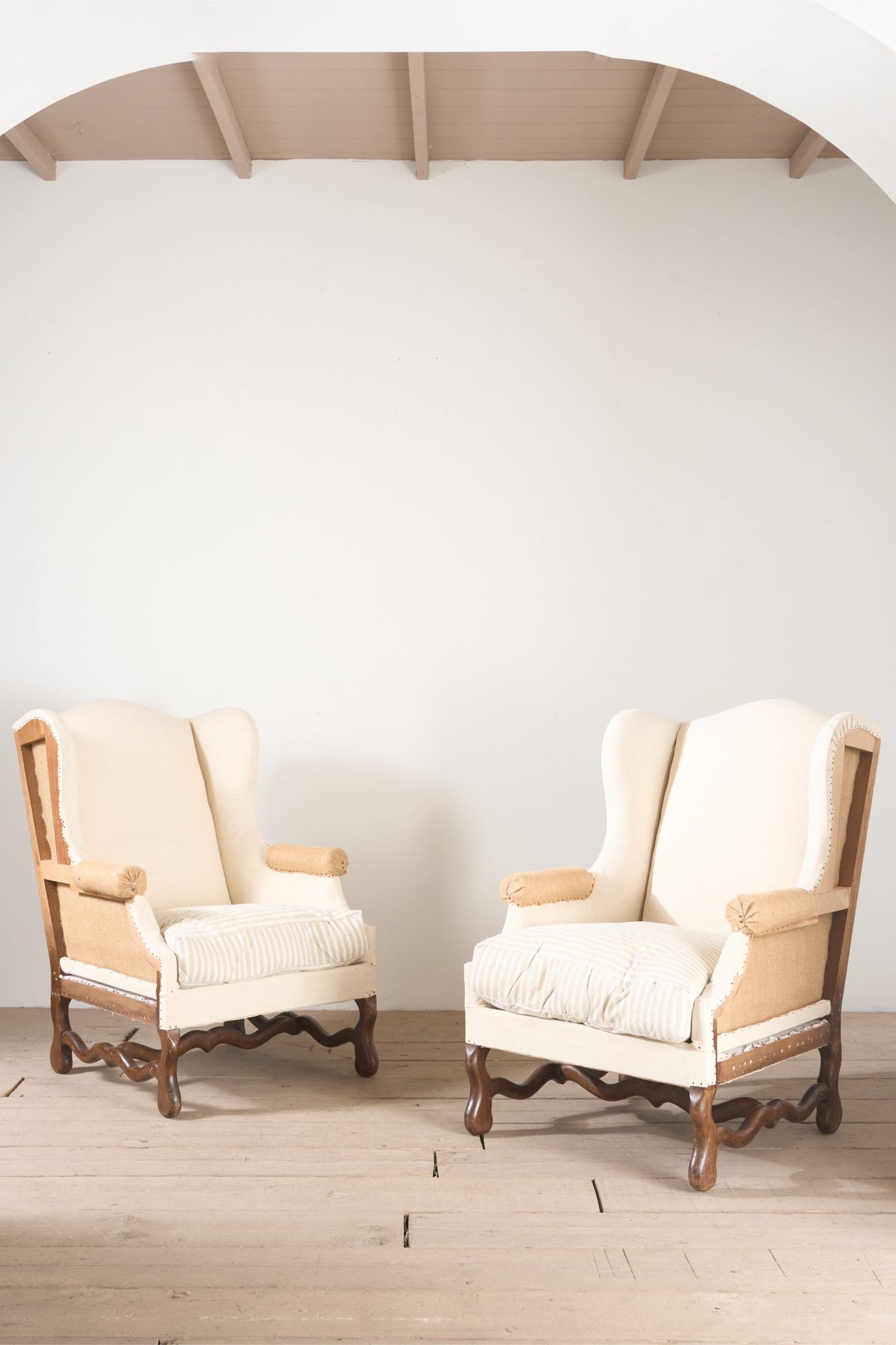 Pair of Early 20th century Os De Mouton wingback armchairs - TallBoy Interiors