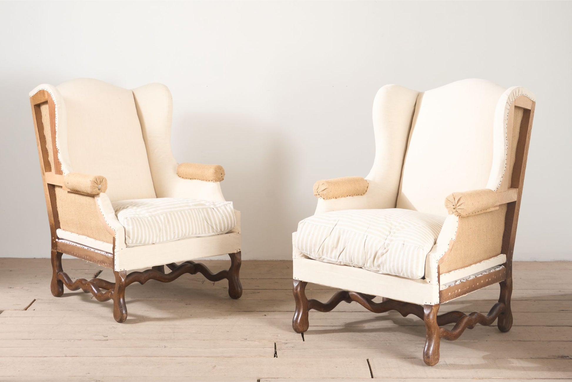 Pair of Early 20th century Os De Mouton wingback armchairs - TallBoy Interiors
