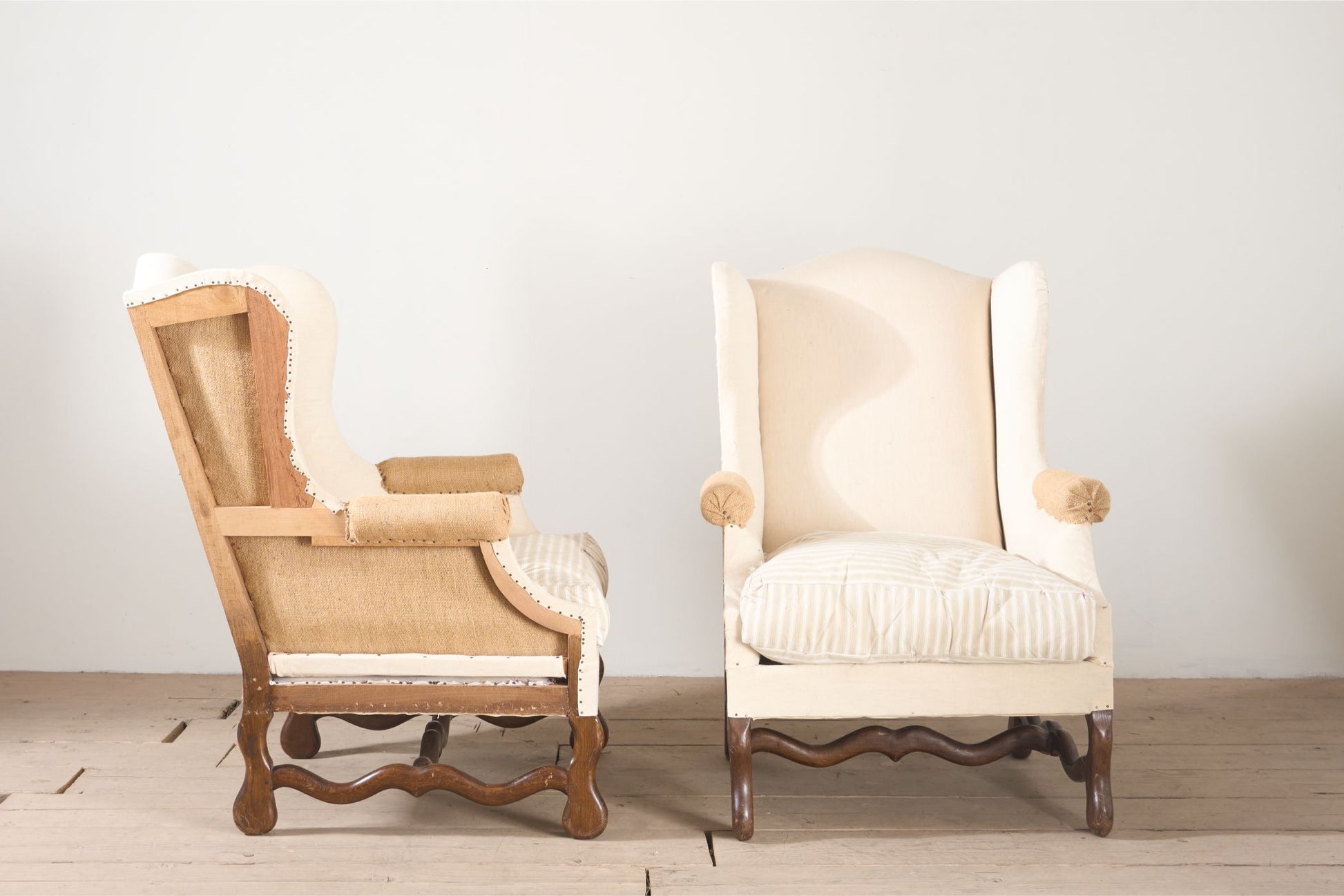 Pair of Early 20th century Os De Mouton wingback armchairs - TallBoy Interiors