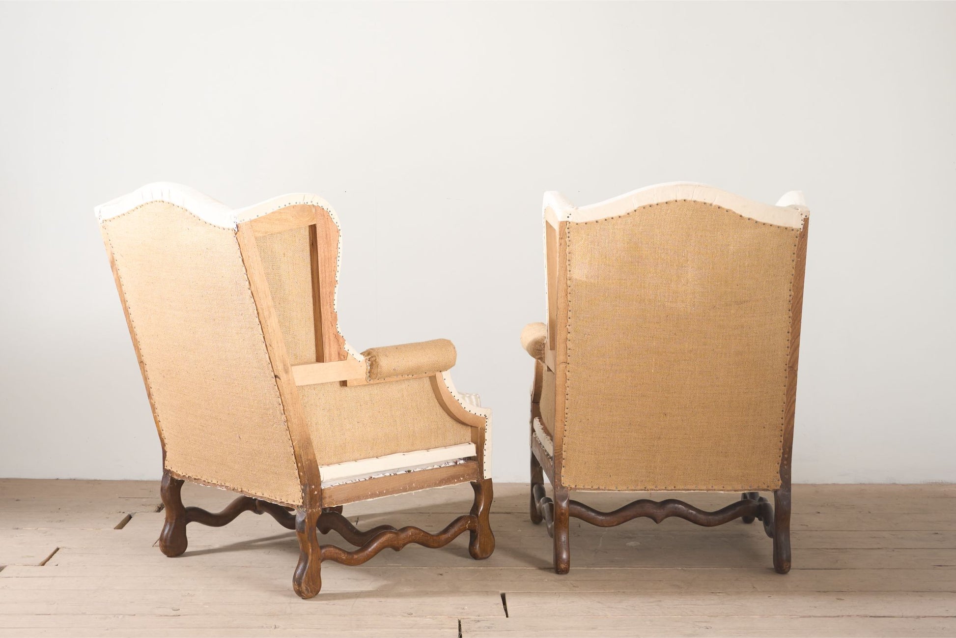 Pair of Early 20th century Os De Mouton wingback armchairs - TallBoy Interiors