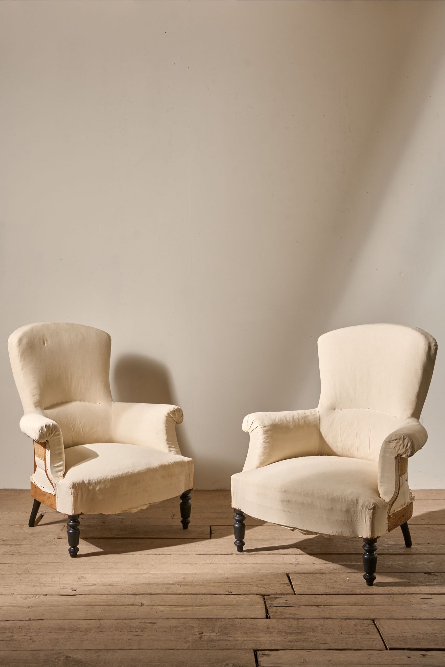 Pair of Napoleon III High backed plain armchairs
