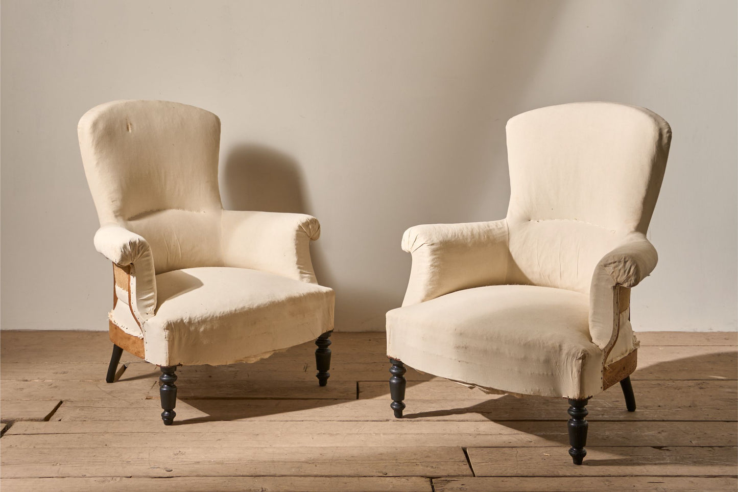 Pair of Napoleon III High backed plain armchairs