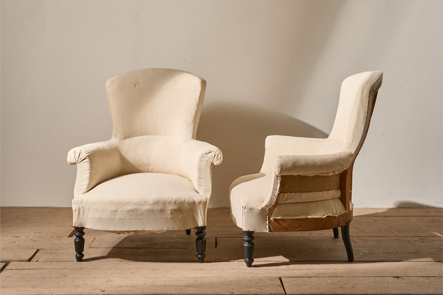 Pair of Napoleon III High backed plain armchairs