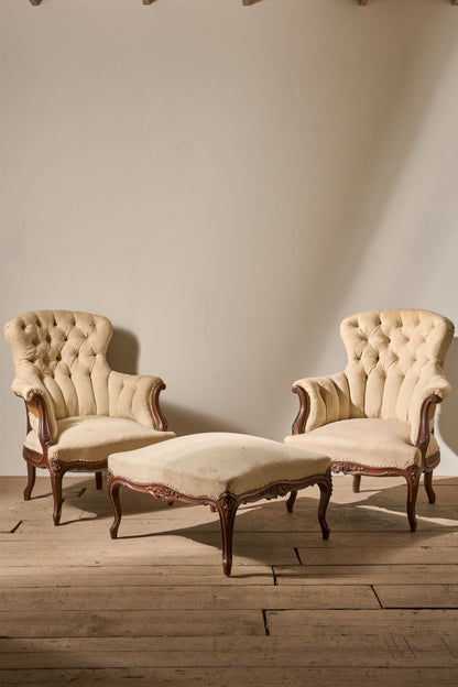 Pair of 19th Century buttoned back armchairs with matching stool