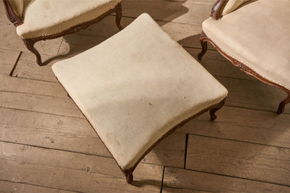 Pair of 19th Century buttoned back armchairs with matching stool