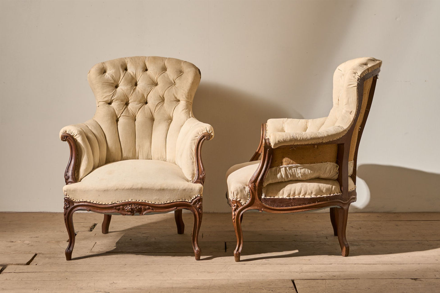 Pair of 19th Century buttoned back armchairs with matching stool