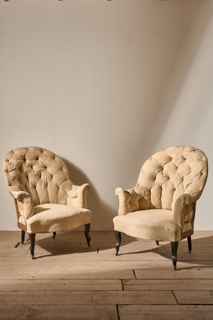 Pair of Napoleon III High buttoned curved back armchairs