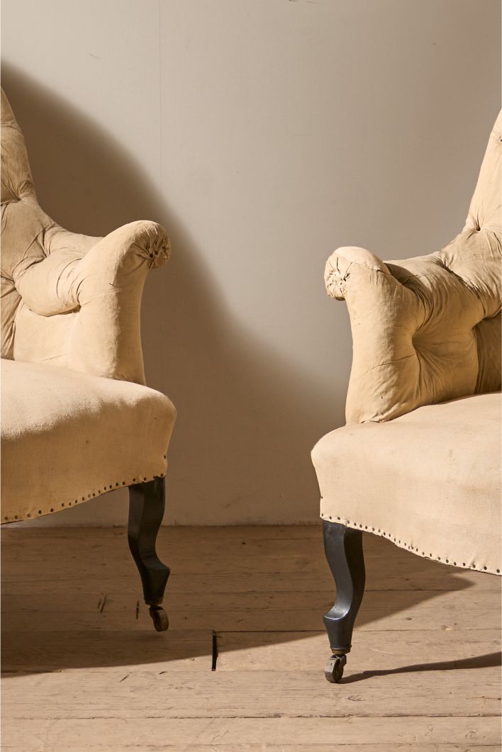 Pair of Napoleon III High buttoned curved back armchairs