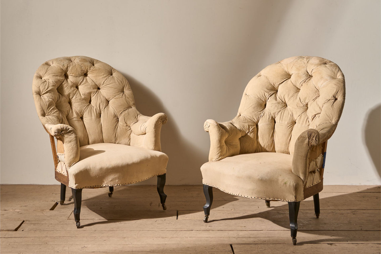 Pair of Napoleon III High buttoned curved back armchairs