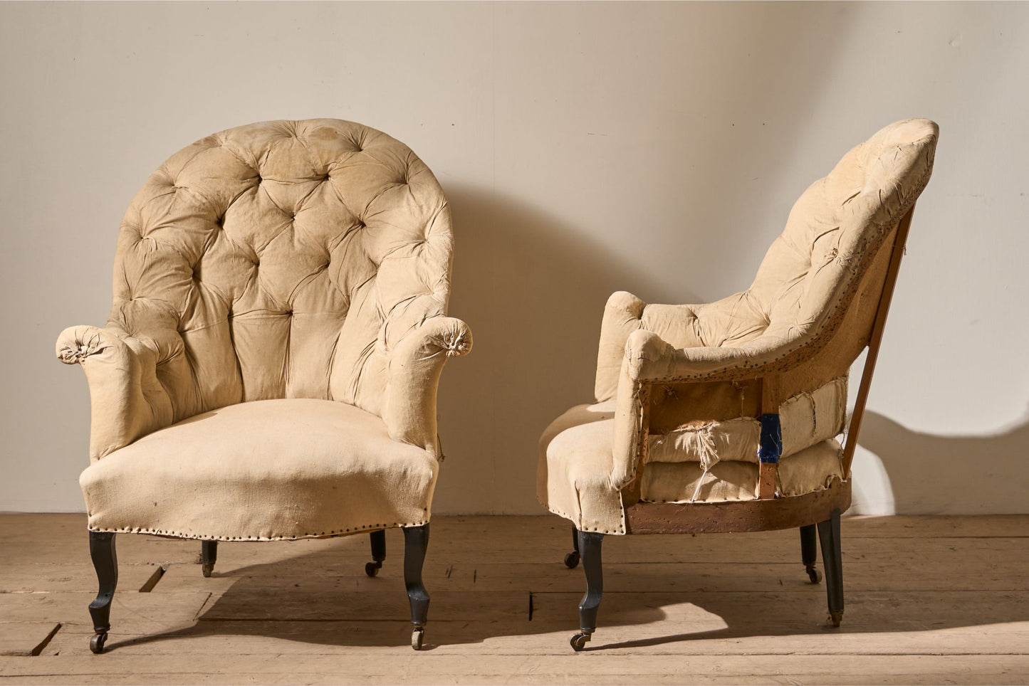 Pair of Napoleon III High buttoned curved back armchairs