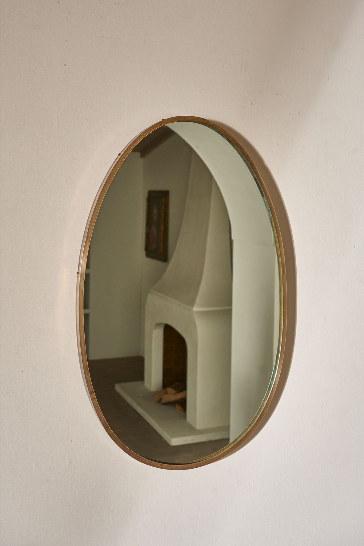 Mid 20th century Italian brass edged oval wall mirror - TallBoy Interiors
