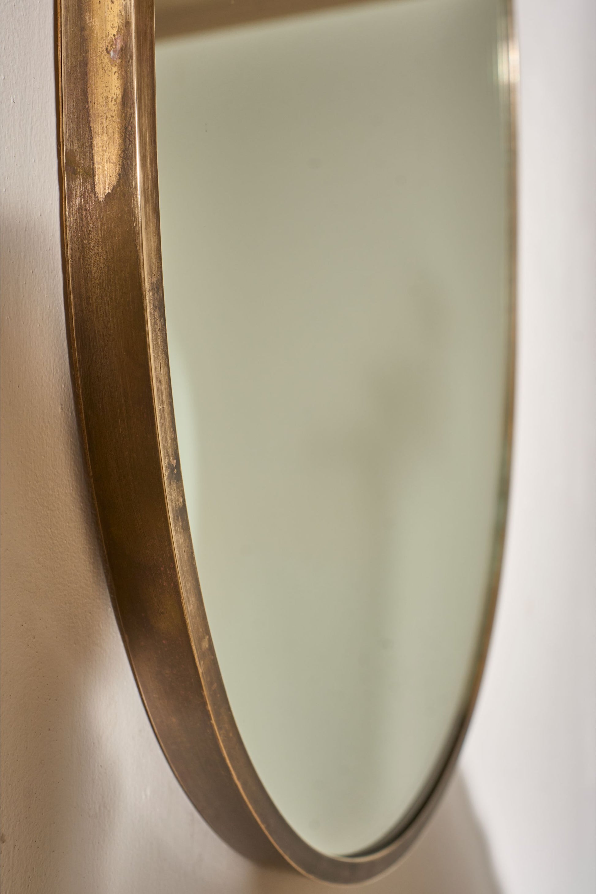Mid 20th century Italian brass edged oval wall mirror - TallBoy Interiors