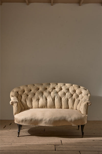 Rare pair of Napoleon III Buttoned back sofas