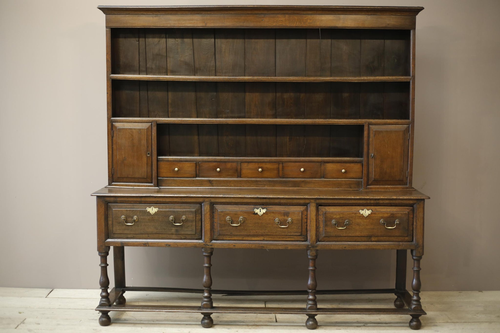 18th century English oak dresser on tall legs