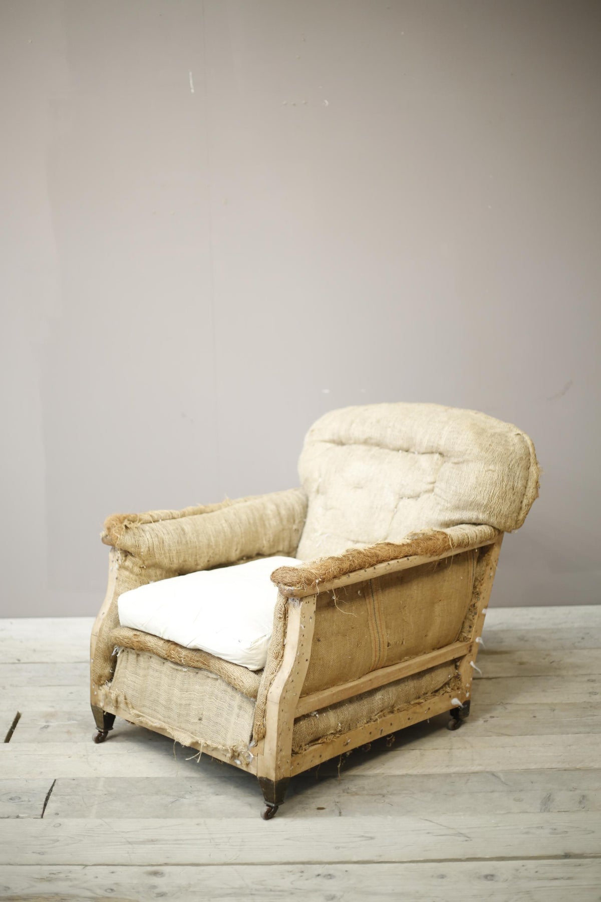 Deep seated Edwardian country house armchair - TallBoy Interiors
