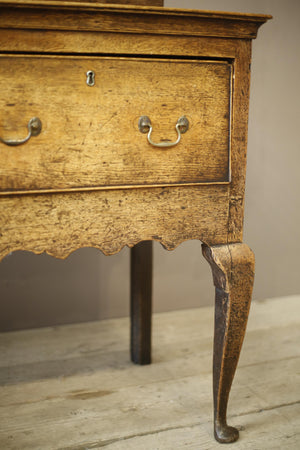 18th century oak dresser base with scalloped front rail