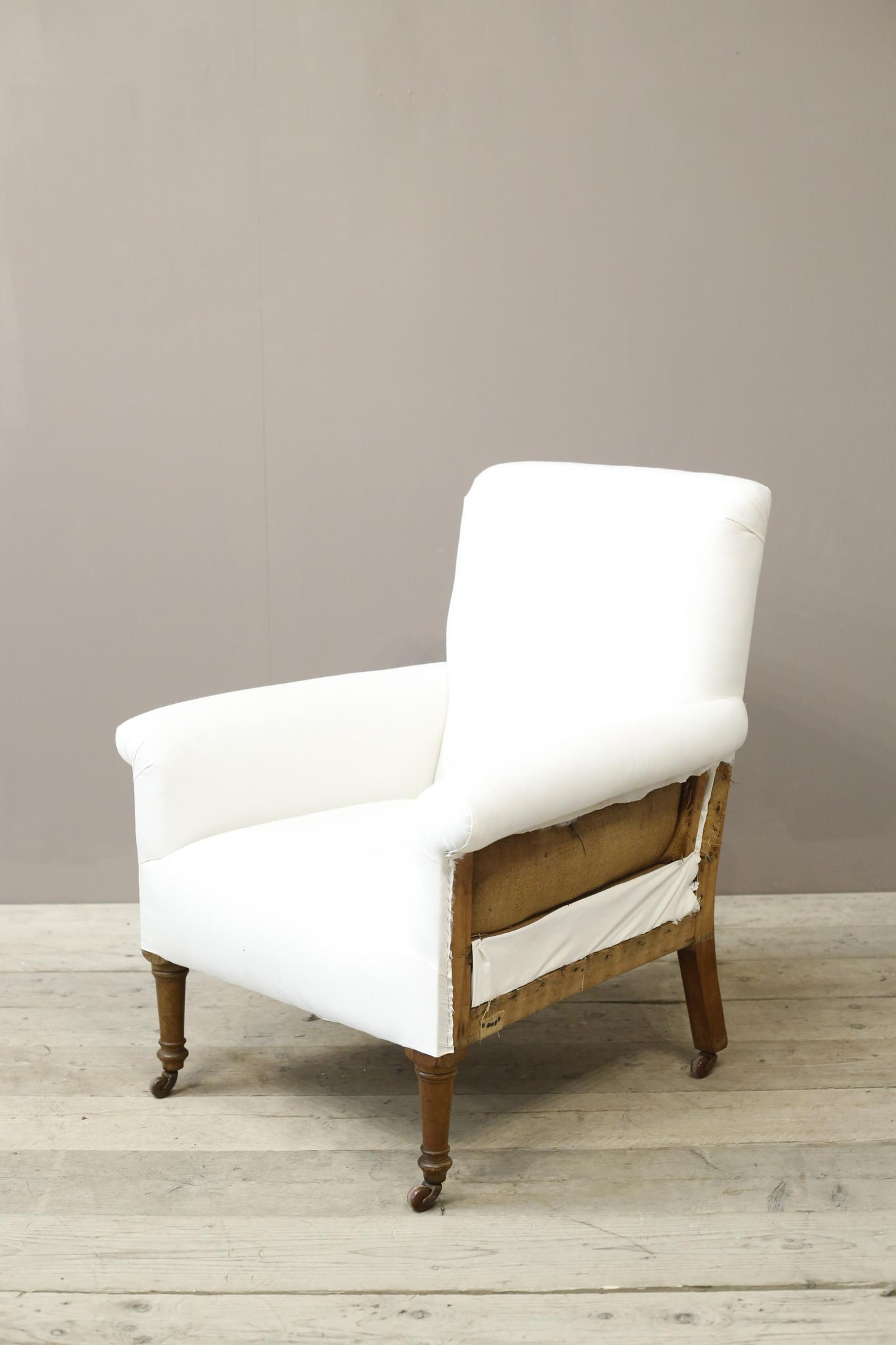 Large proportioned Edwardian armchair on tall legs