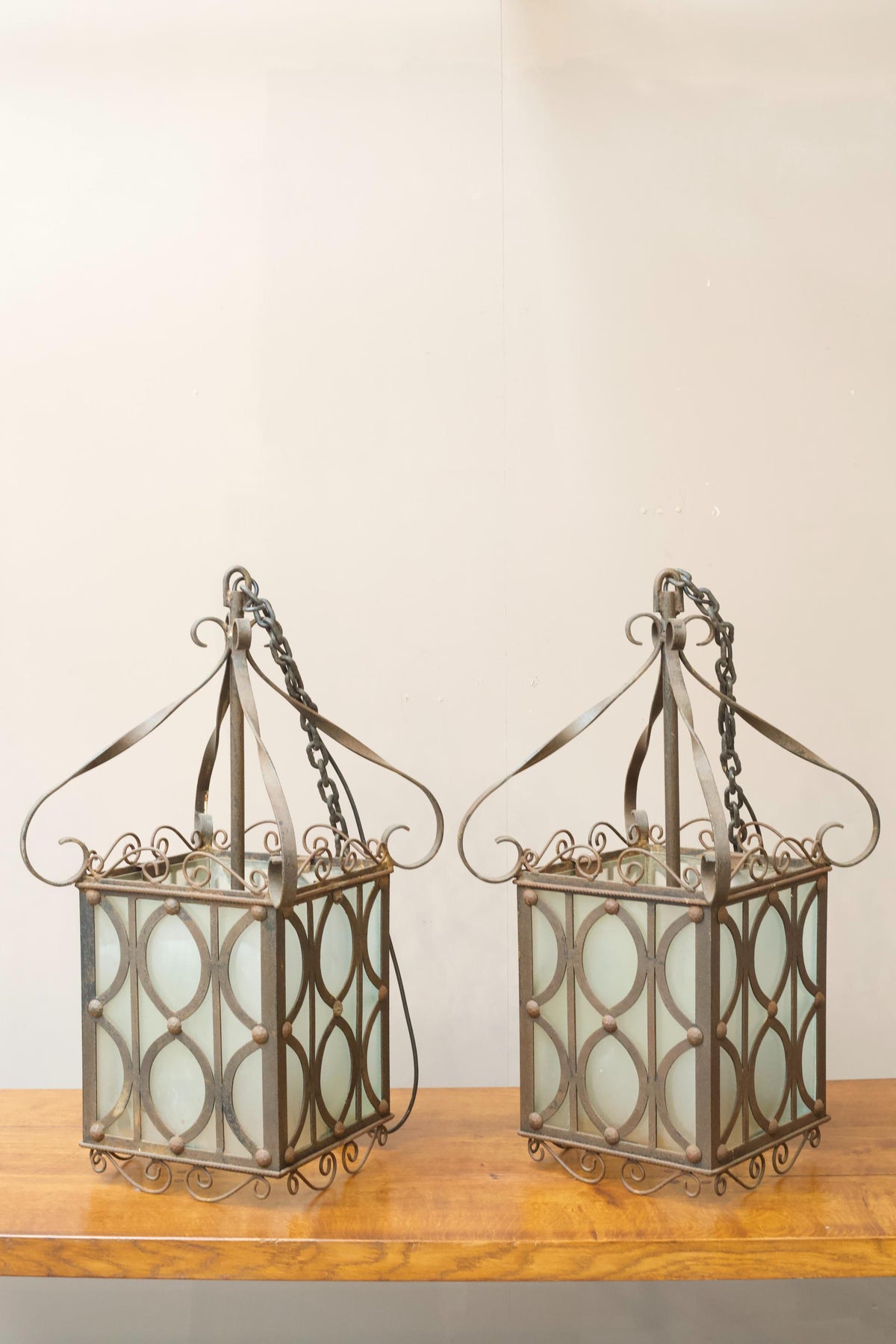 Pair of early 20th century Iron and frosted glass hanging lanterns - TallBoy Interiors