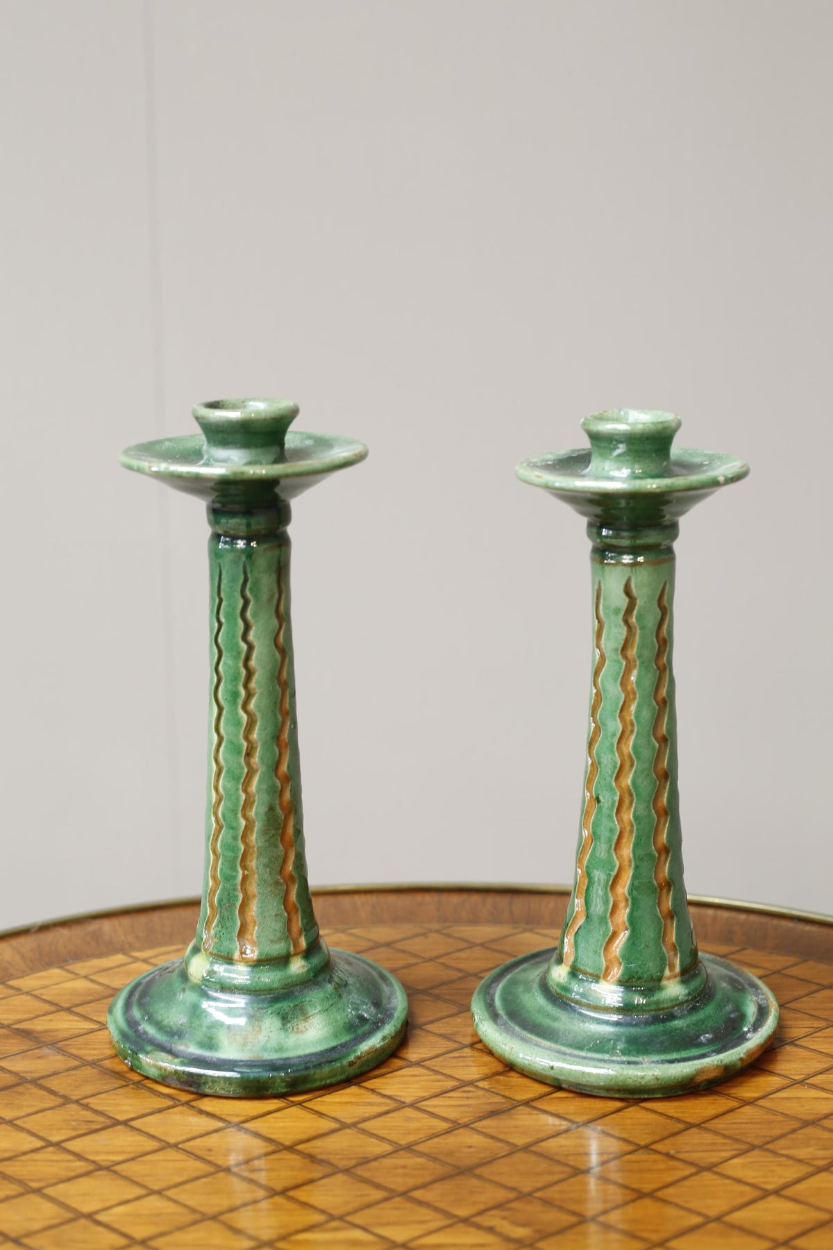 Pair of early 20th century Spanish Green glazed candle sticks - TallBoy Interiors