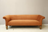 Victorian country house sofa in rust velvet