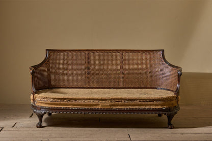 c.1900 Bergere sofa with shapely arms