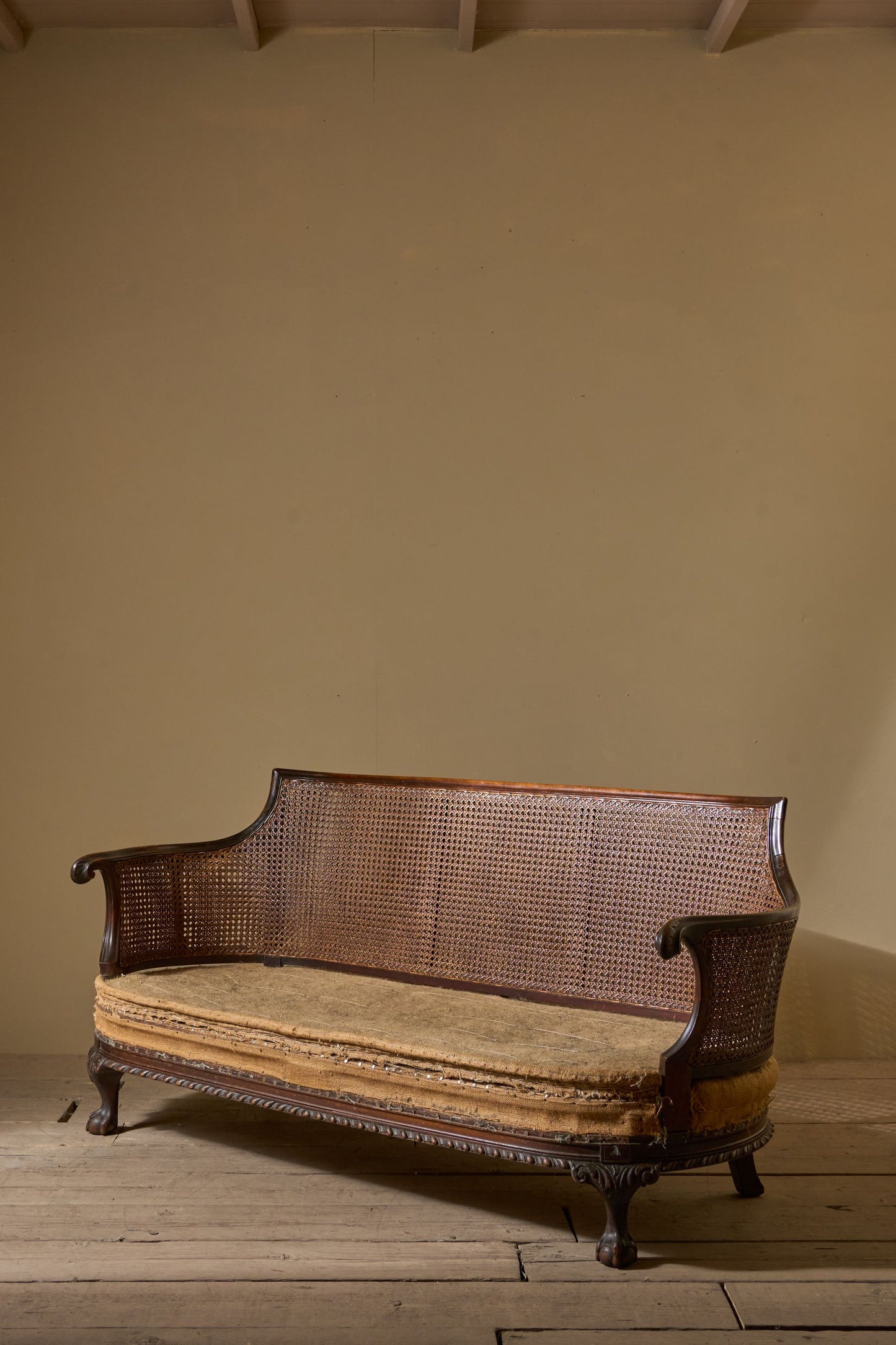 c.1900 Bergere sofa with shapely arms