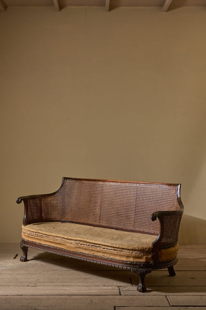 c.1900 Bergere sofa with shapely arms