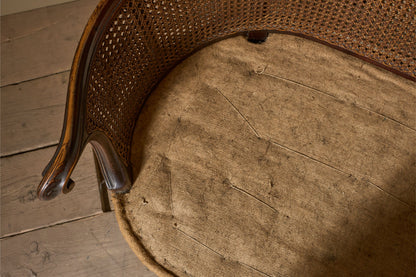 c.1900 Bergere sofa with shapely arms