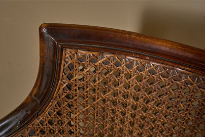 c.1900 Bergere sofa with shapely arms