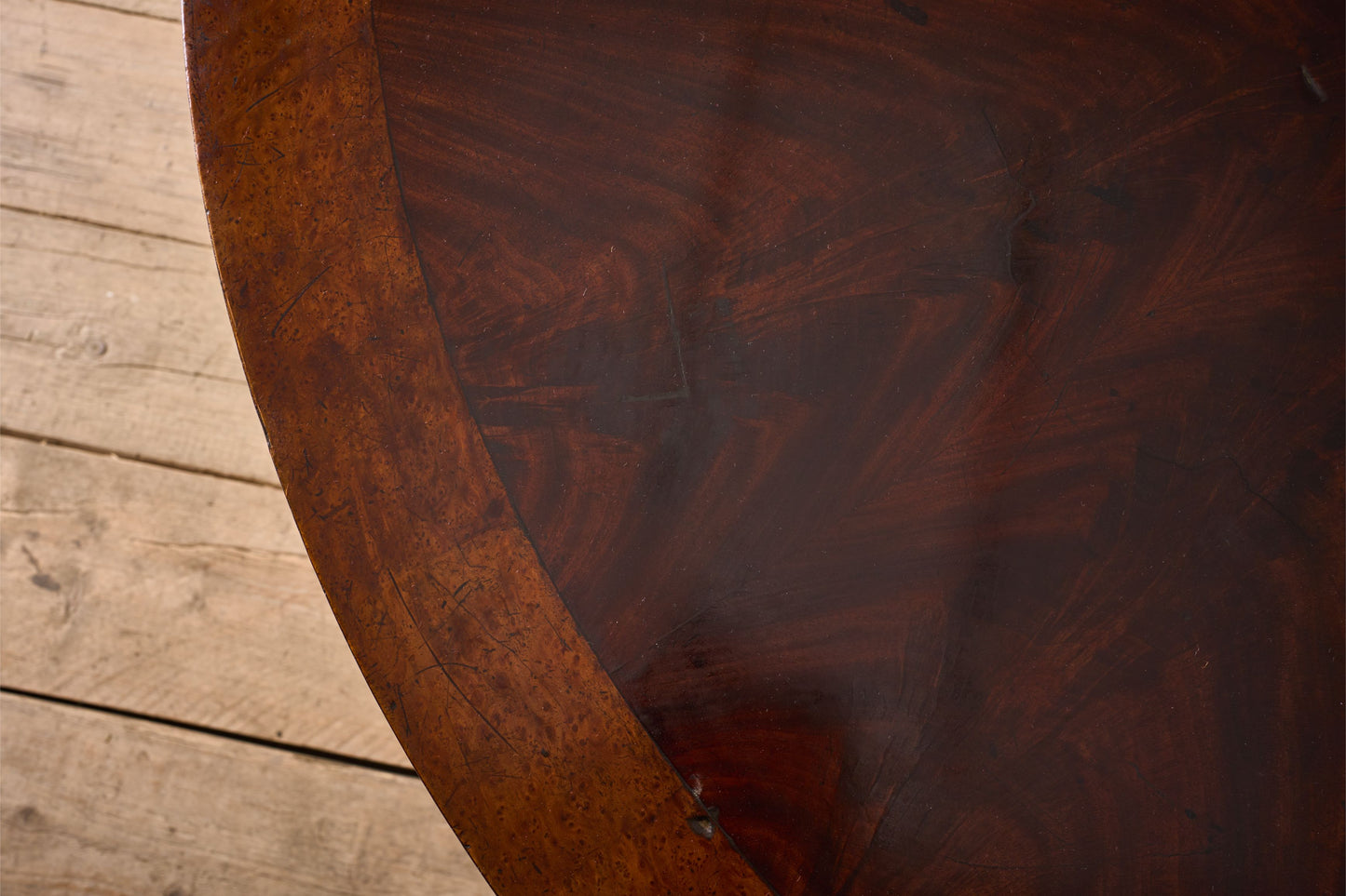 Regency period Flame mahogany and maple centre table.