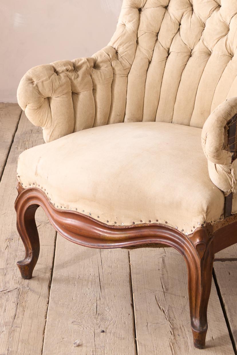 19th century French buttoned iron back armchair