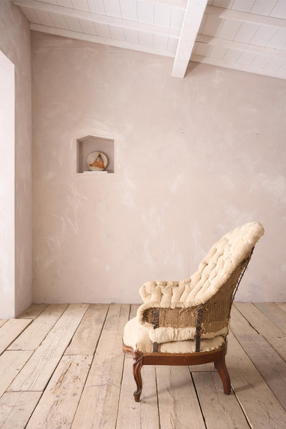 19th century French buttoned iron back armchair