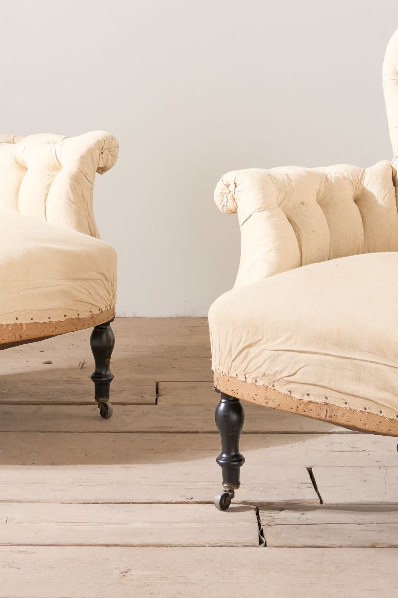 Pair of Napoleon III buttoned spoon back armchairs