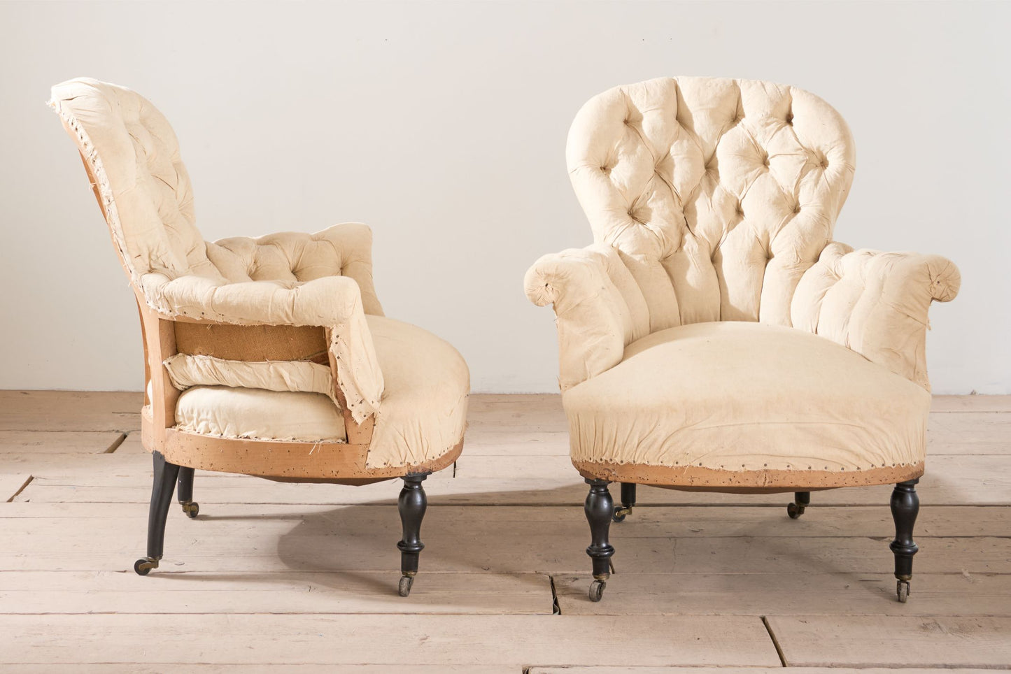 Pair of Napoleon III buttoned spoon back armchairs