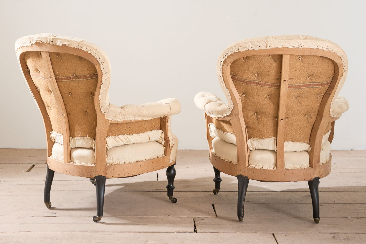 Pair of Napoleon III buttoned spoon back armchairs