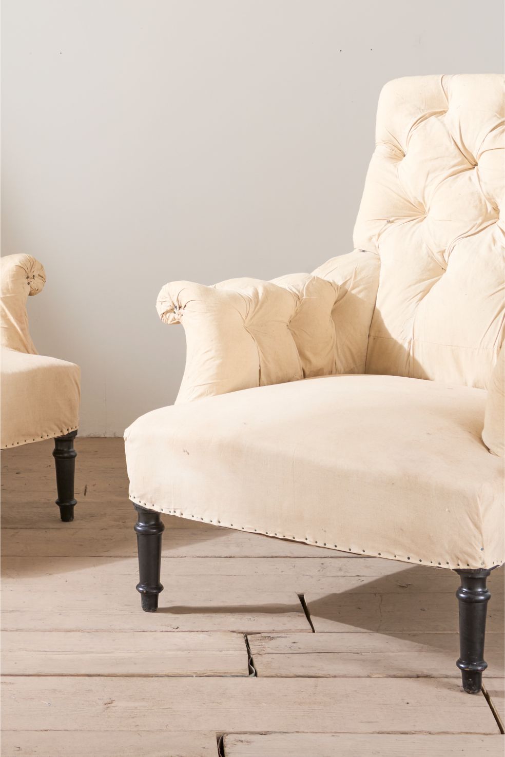 Pair of Napoleon III buttoned square back armchairs