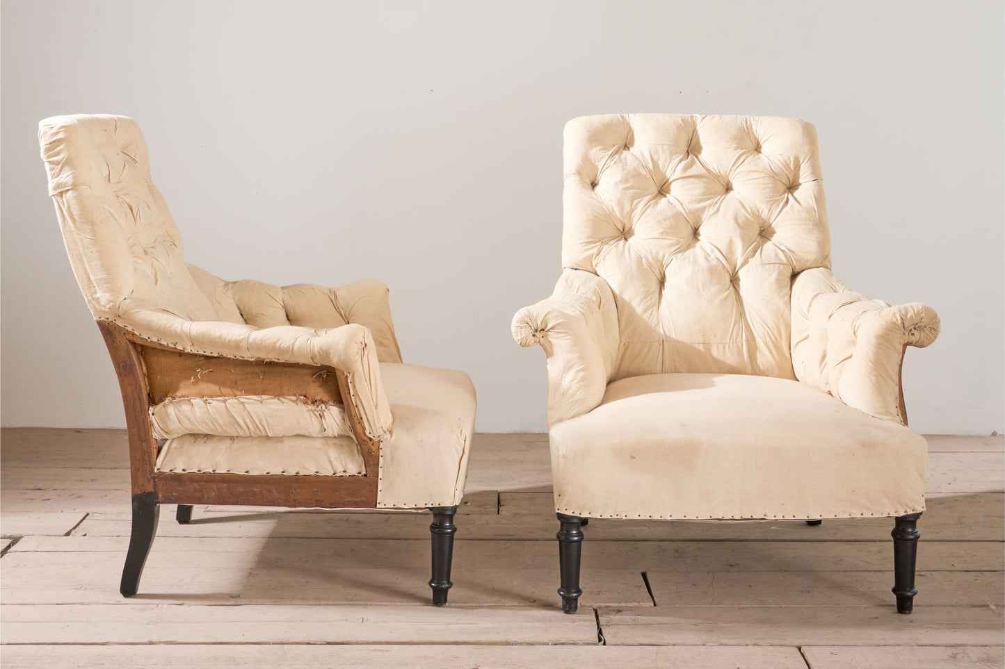 Pair of Napoleon III buttoned square back armchairs