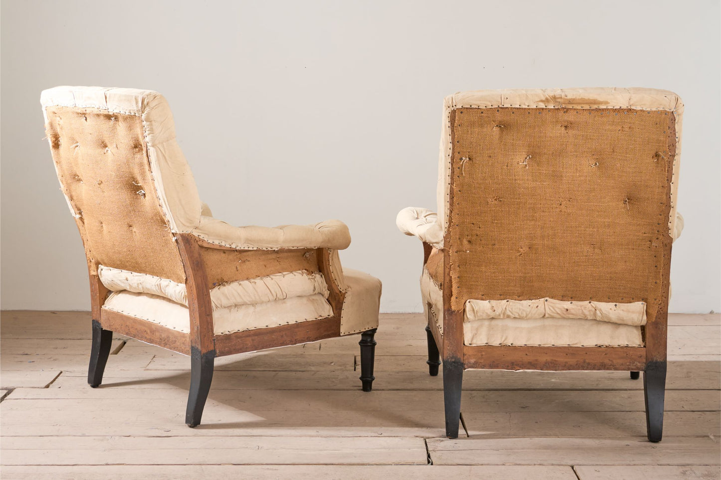 Pair of Napoleon III buttoned square back armchairs
