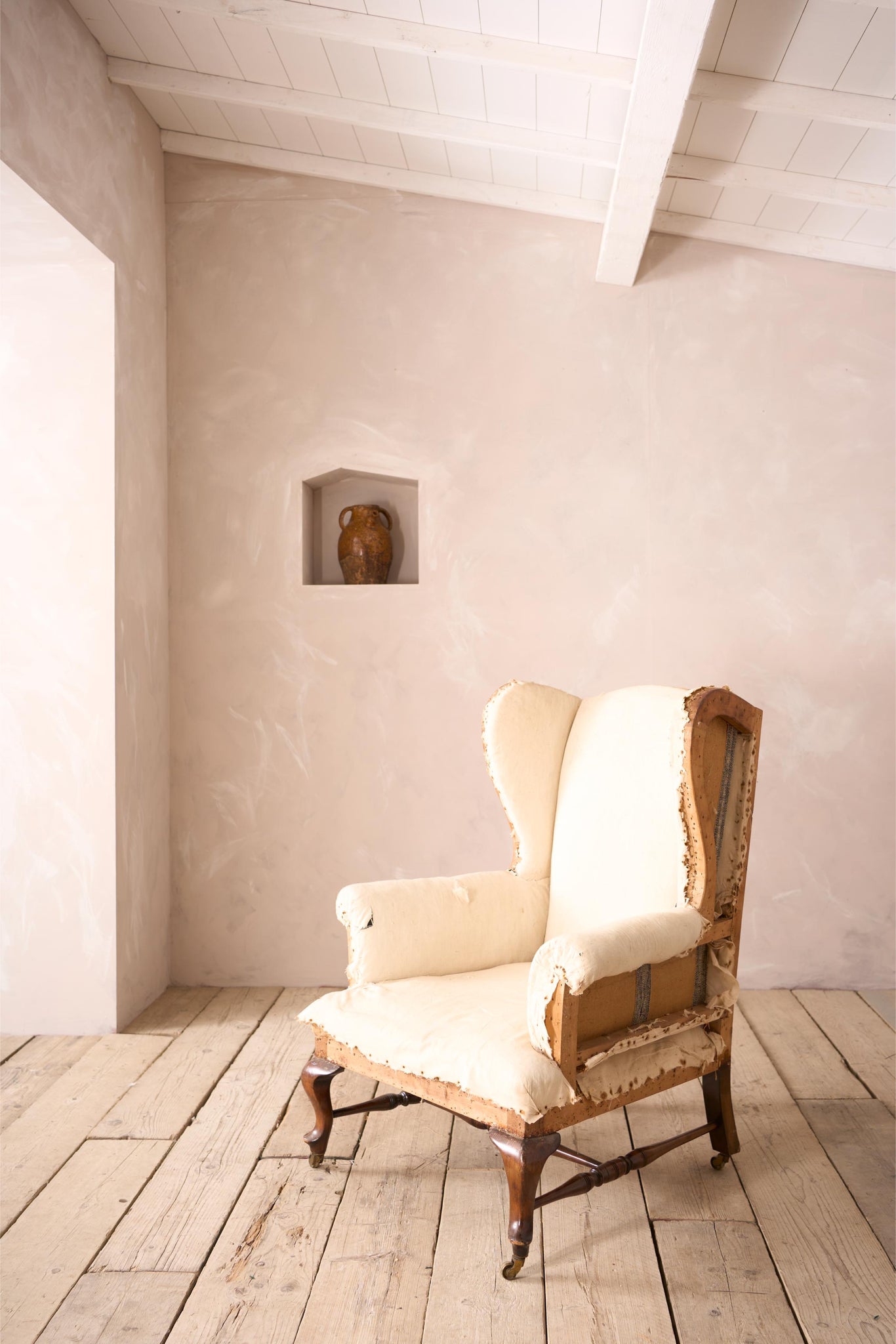 Victorian stretchered wingback armchair by John Reid & Sons