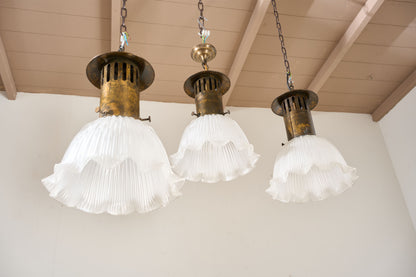Trio of 20th century Holophane pendant lights