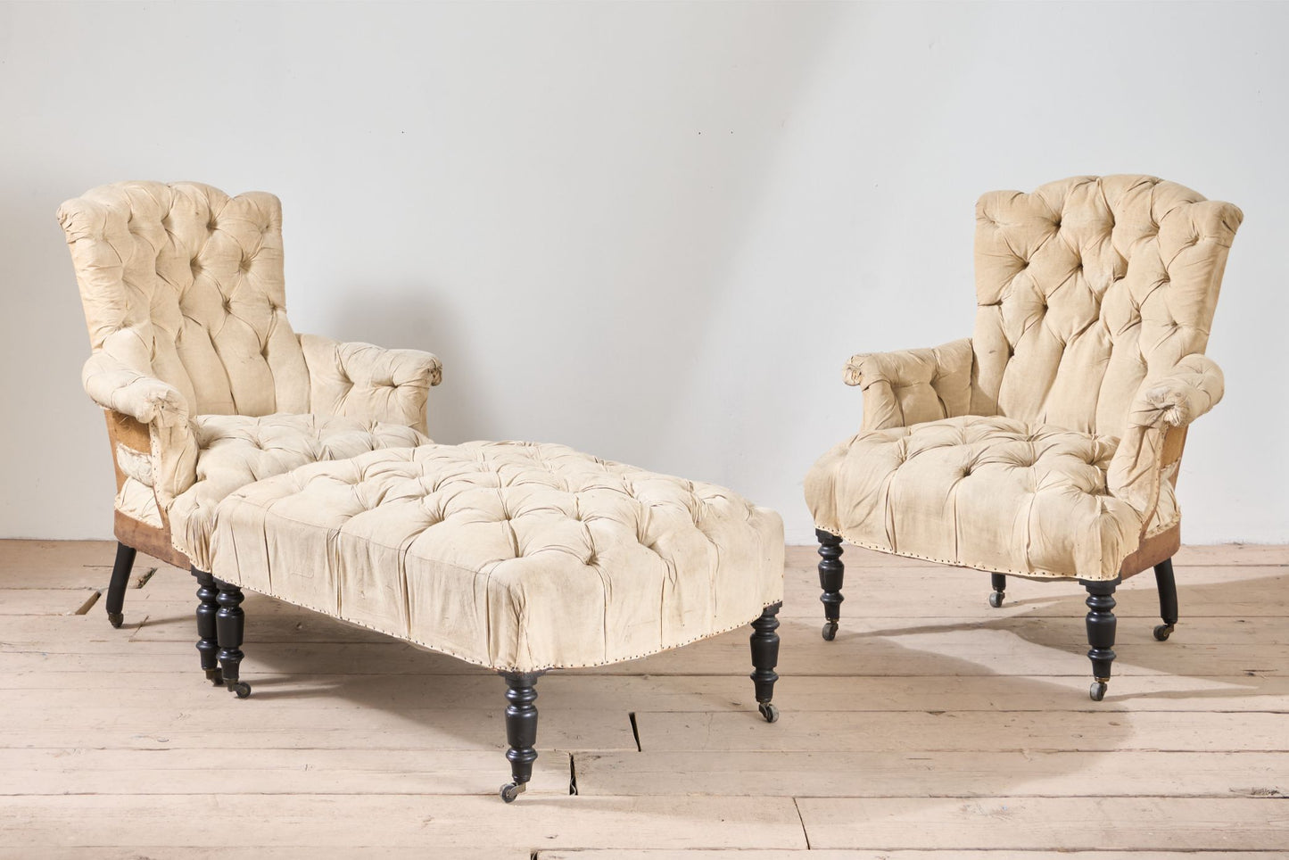 Rare Napoleon III pair of Buttoned back and seat armchairs with matching stool